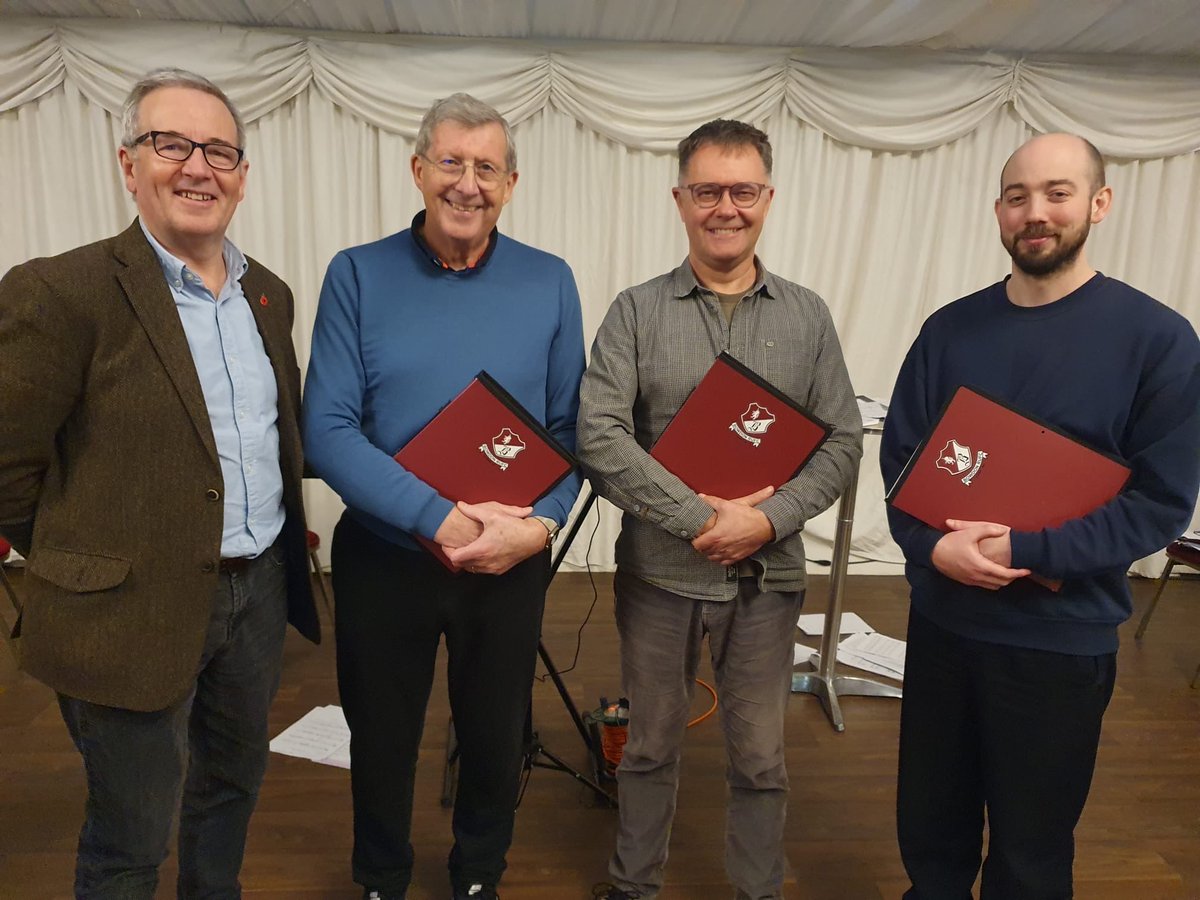 A couple more choristers receiving their music folders as our merry band grows. We are up to 40 in total now - not bad in 5 years!