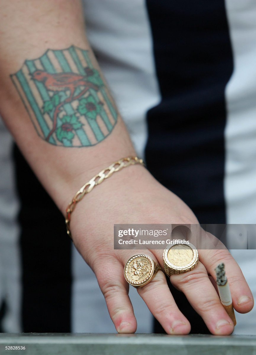 A WBA fan looks on as he has a cigarette during the Barclays Premiership match between West Bromwich Albion and Portsmouth at The Hawthorns (2005)