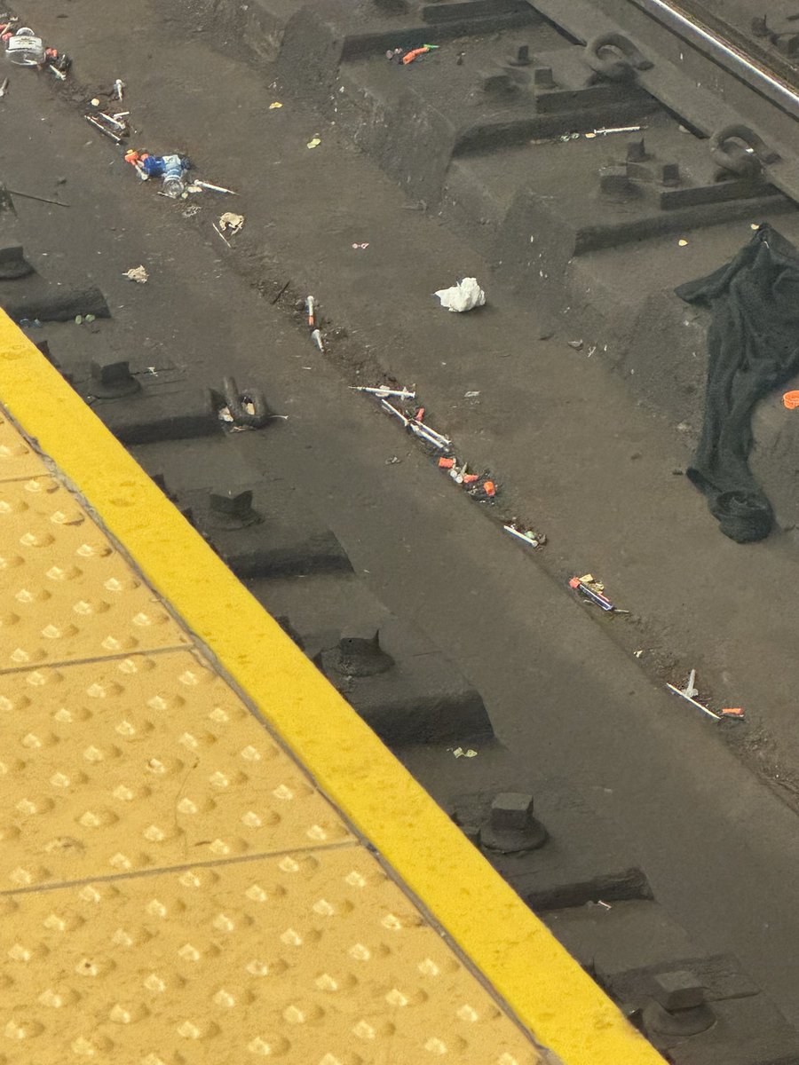 nv1978's tweet photo. @NYCTSubway @MTA @nyc311 @NYCMayorsOffice @NYPDCommAffairs @NYCMayor - this just disgusting how we have people shooting up and tossing all their needles etc on the tracks. This is 110th Street on the 6 Train.  The amount of stuff on the tracks will end up causing a fire one day https://t.co/V0ywAsvRV0