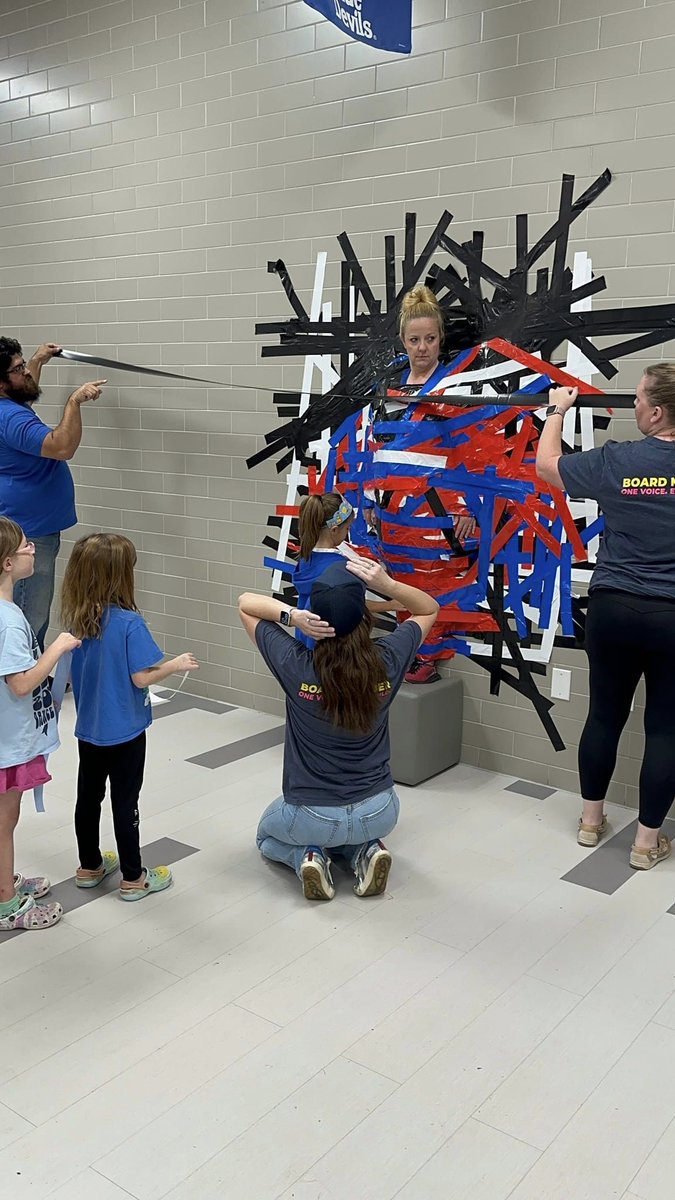 YalePTA's tweet photo. Principal @ccgreer28 *stuck* to her word and let our more than 130 student PTA members tape her to the cafeteria wall today! 🤣 Way to go, @yaleroadrunners!  ❤️💙

Haven't joined PTA yet? Get in on the fun here: https://t.co/fcE0NS8GpW https://t.co/HcuI5tpvjF