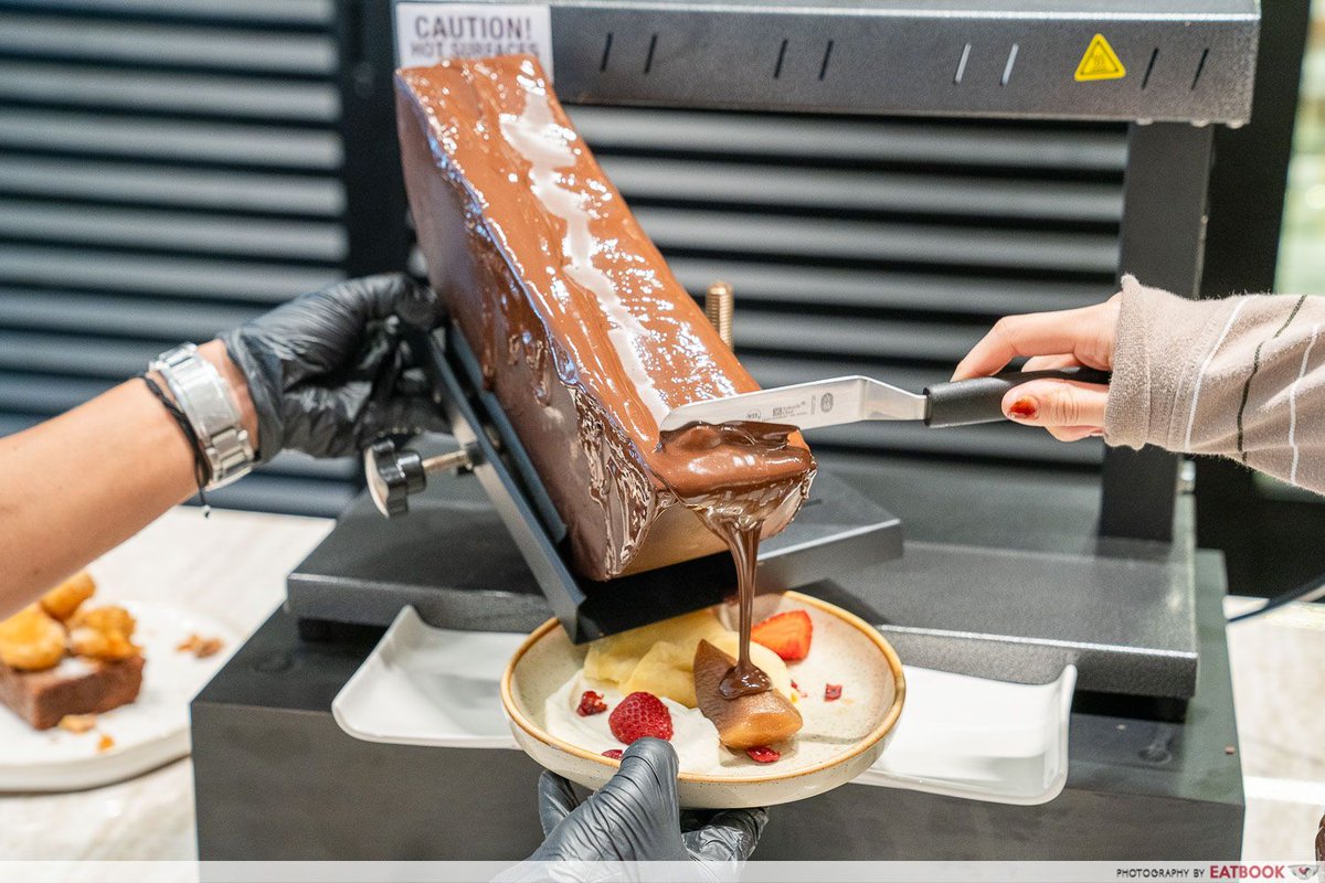 raclettecorner's tweet photo. Who new? Ever heard of Chocolate Raclette? A chocolatier in Singapore uses the TTM Raclette melter to melt a half wheel of chocolate. If you can find the chocolate wheel, we have the melter. See for yourself: https://t.co/fv1D0pdlxz 
#raclette #chocolateraclette https://t.co/ROqnXUuL3N