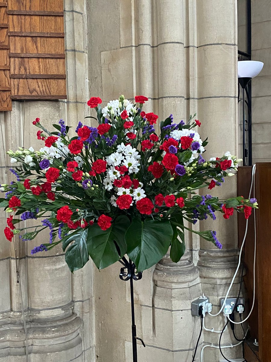 St Hilda's poppy display for Remembrance Sunday. The flower arrangement is composed of red for the  men and women, purple for the animals and white for peace and hope.