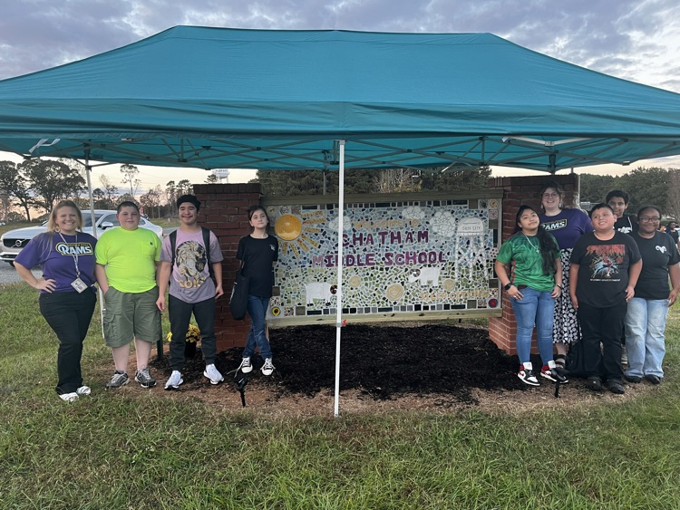 ChathamCoSch's tweet photo. We were blown away by the artistry now on display at @ChathamMiddle, as the CMS NCMA AIM Art Club held an unveiling of the new school mural they've been creating for months! What a beautiful representation of the city and the school. 💜💛 #OneChatham #CMS family https://t.co/G4JNlRpuyh