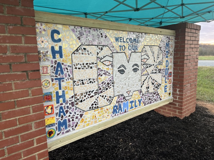 ChathamCoSch's tweet photo. We were blown away by the artistry now on display at @ChathamMiddle, as the CMS NCMA AIM Art Club held an unveiling of the new school mural they've been creating for months! What a beautiful representation of the city and the school. 💜💛 #OneChatham #CMS family https://t.co/G4JNlRpuyh