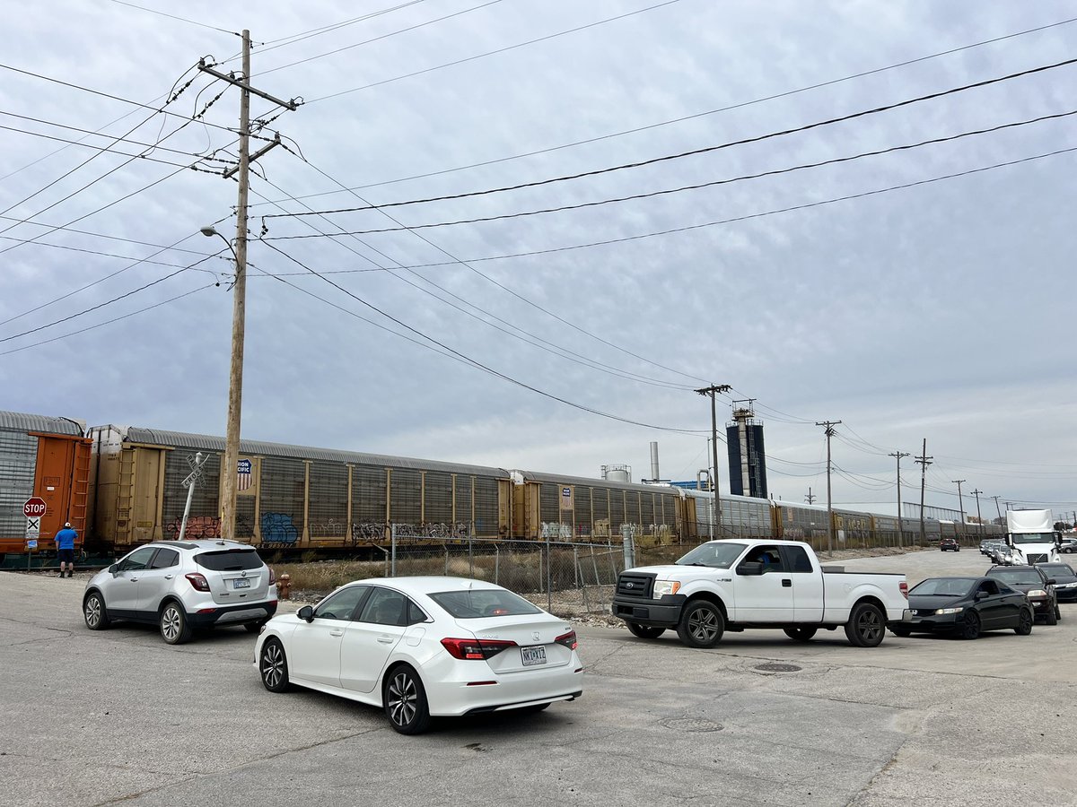 DePrisco's tweet photo. Hey @BNSFRailway @UnionPacific @KCKPDHQ @KDOTHQ this train has been parked for over 35 mins, your one car short of clearing the crossing! There are 35 cars waiting to cross the tracks. This is also the 2nd time today! How about we fix the Kansas Avenue bridge! https://t.co/2tSJU6IzjV