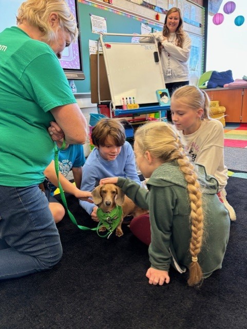 wag_j's tweet photo. Ms. Myra Reid from PAWS Pet Therapy visited IES with her dachshund, Tinker! Ms. Myra also brings in Lilly, Tinker’s sister for visits! https://t.co/3hi4s1vLve