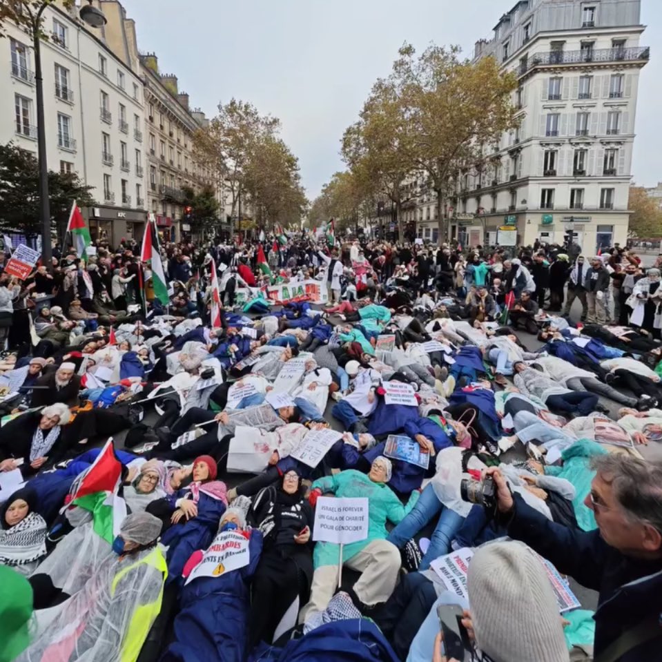 gazanotice's tweet photo. Healthcare workers in Paris staged a die-in demonstration to express solidarity with their counterparts in northern Gaza hospitals, including Kamal Adwan Hospital, which have been under intense Israeli siege and subjected to repeated attacks for over a mont https://t.co/rIbDSxuW0L