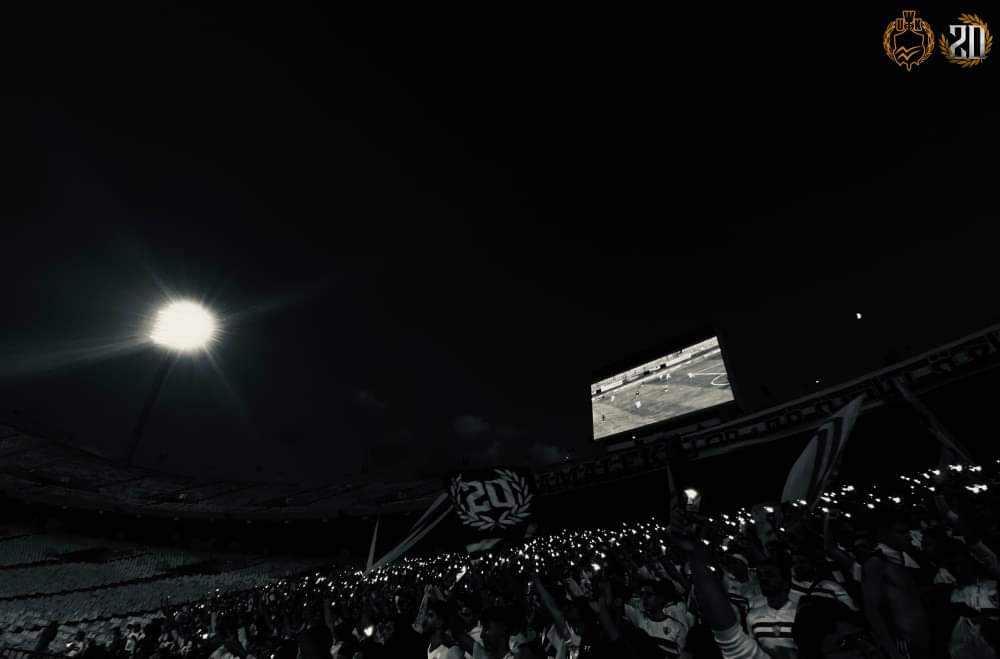 White07Knights's tweet photo. "الفخر والمجد والتاريخ يعرفني، والسيف والدرع والقوس والسهم"

هُنا نادي الزمالك التاريخ والحاضر والمُستقبل، أكبر قلعة رياضية في مصر، نفتخر بالإنتماء إليه، ونقف ندافع عنه وندعمه ونرفع رايته.

كَمَا قُلنا سابقًا أن "حناجرنا أبدًا لن تصمت" وأننا صوت الزمالك دائمًا وأبدًا، وأينما حل وإرتحل سيتواجد فُرسانه الأوفياء خلفه.

وفي كل إستاد تروحه .. تجيب مِنهُ إنتصار. ⚪🔴

(جانب مِن حضور المجموعة لمُباراة الزمالك وسموحة في الدوري العام)