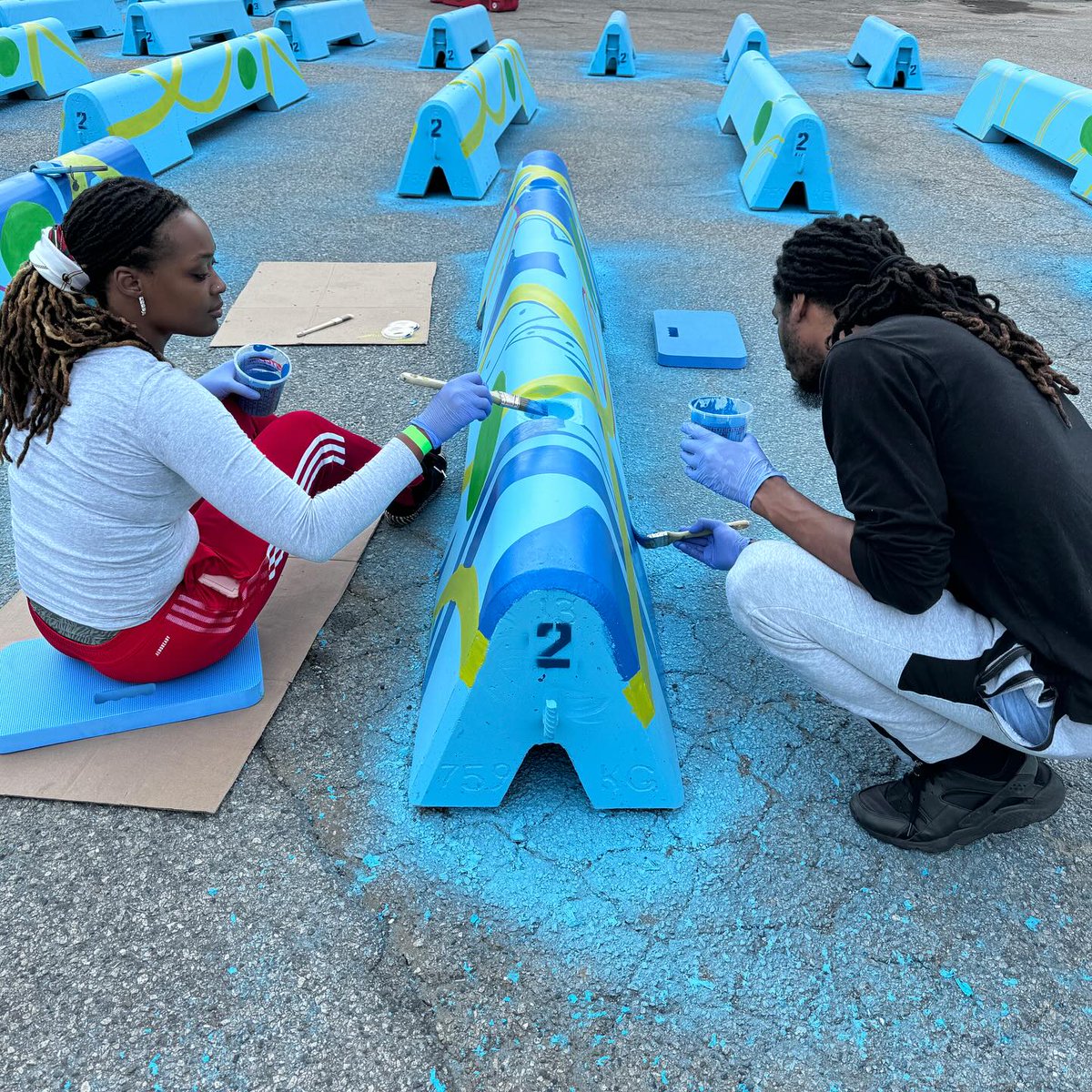 ATLDOT's tweet photo. The Midtown Bike Lane Barrier Mural is in full swing, but we still need your help to bring the vision to life. Plenty of barriers are still waiting for you to leave your mark on this exciting community project! All experience levels welcome. 
Learn more at https://t.co/eanD0M5cMP https://t.co/fhTSXMcFuk