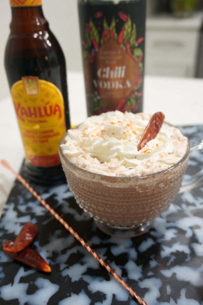 A spicy adult hot chocolate? Yes, please!

Picante Cacao
- 1 oz Chili vodka
- ½ oz Kahlua
- 4 oz hot chocolate

Combine vodka &amp; Kahlua in a mug &amp; stir lightly. Add hot chocolate &amp; whipped cream. Garnish with a sprinkle of cayenne.