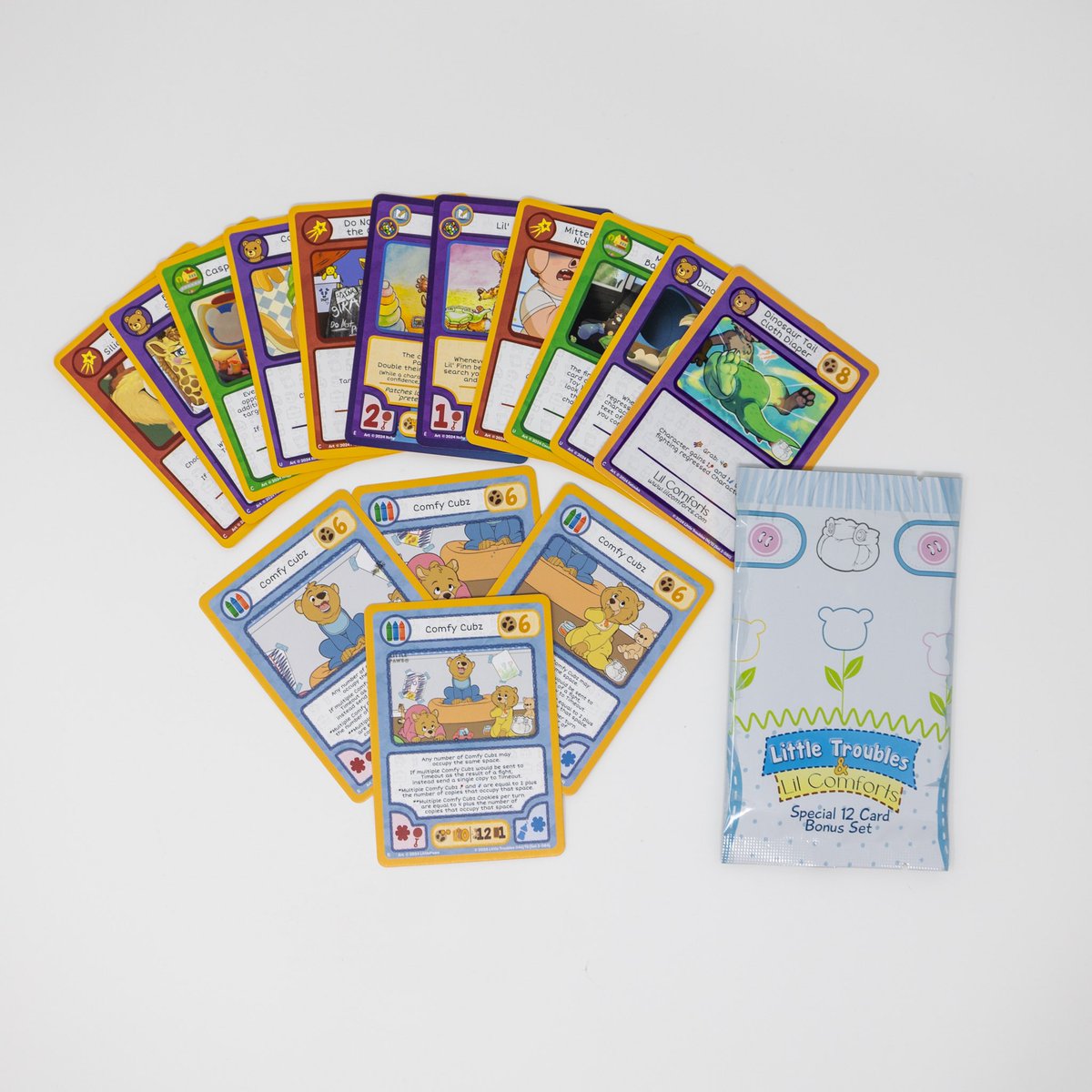 LilComforts's tweet photo. We’re excited to announce our partnership with a Babyfur + Regression trading card game, and we’re now offering our very first set of Lil Comforts cards! As a longtime fan of TCGs, being part of the design and creation process has been such an amazing experience. Be sure to check them out at @LilTroublesTCG 

In each pack you get a fixed set of 11 cards, and 1 special Cubz Card; but you can get all 4 if you get the full 4 pack set~  🧸