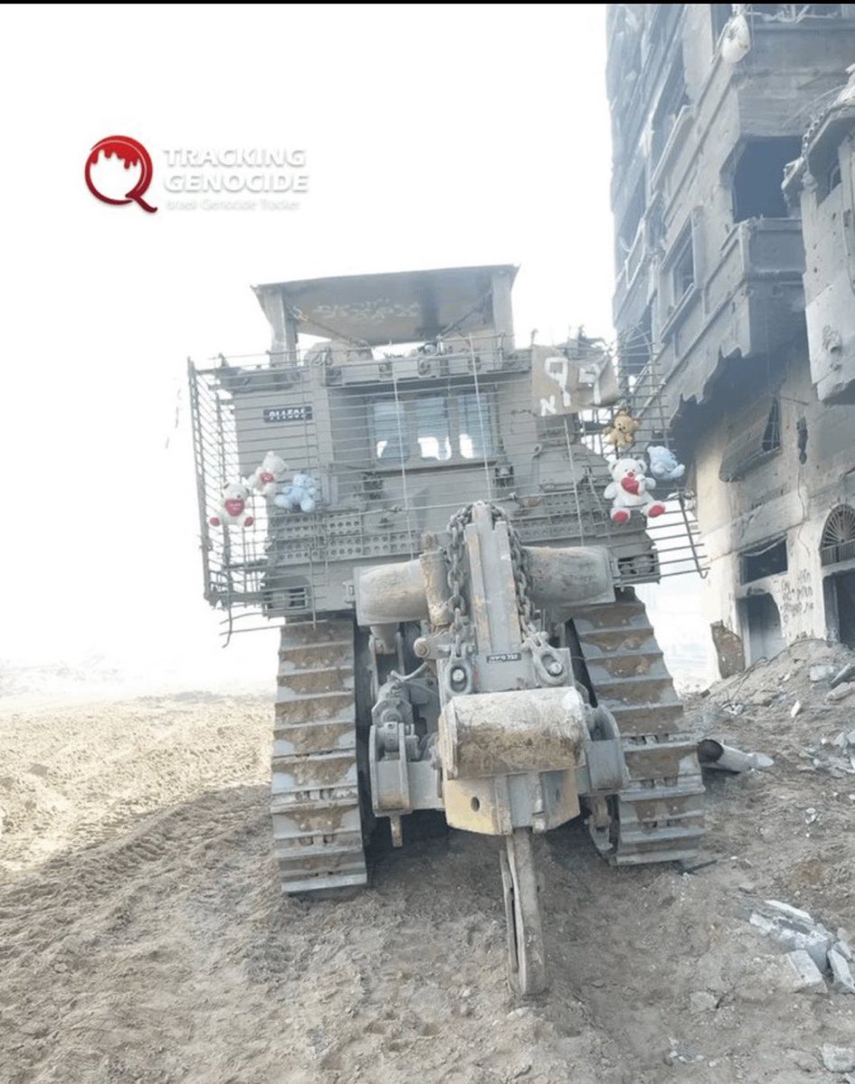 QudsNen's tweet image. Israeli occupation soldiers shared a photo of a D9 bulldozer decorated with toys belonging to displaced or killed Palestinian children while they were wreaking havoc in Gaza.