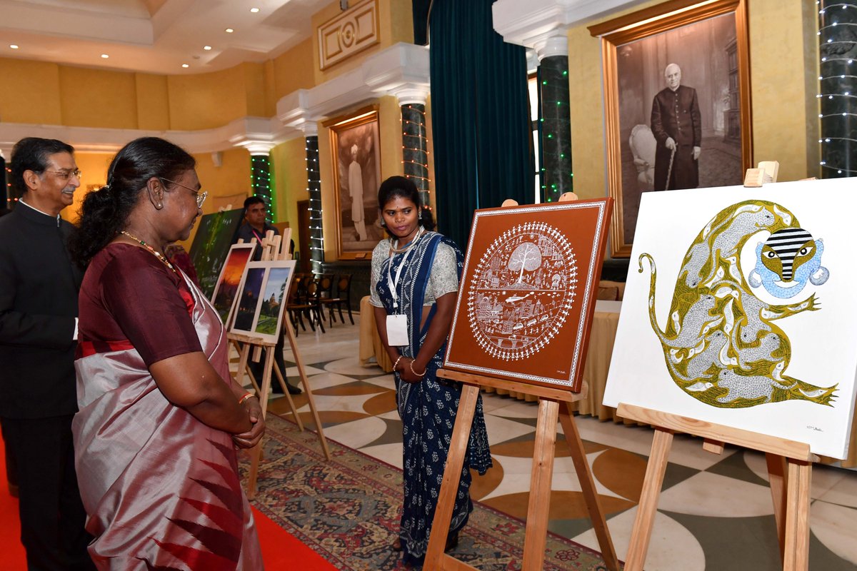 rashtrapatibhvn's tweet photo. President Droupadi Murmu visited the exhibition showcasing the paintings made by tribal artists at Rashtrapati Bhavan Cultural Centre. The President appreciated the artworks created by the artists belonging to various parts of the country. She said that the eternal relationship between human beings and nature is reflected in their paintings. She urged all to appreciate and promote the rich art and culture of tribal communities.

The artists have made these paintings during their week-long stay at Rashtrapati Bhavan.