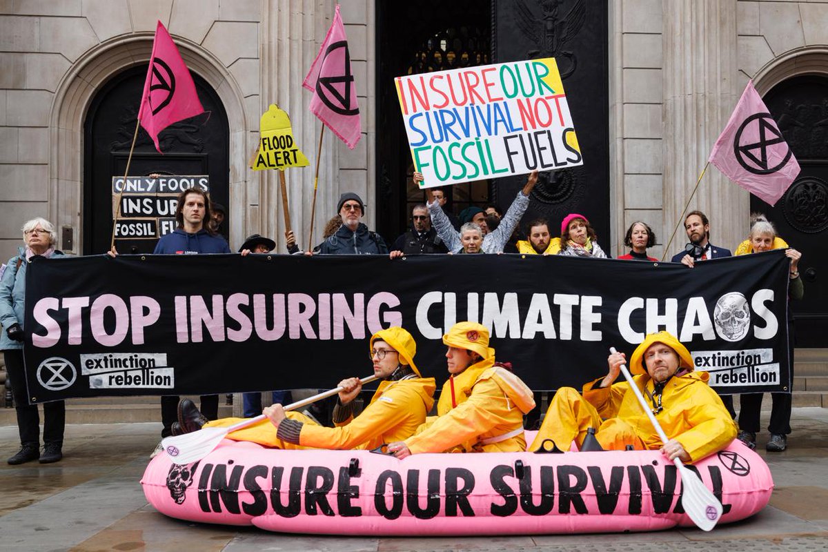 XRebellionUK's tweet photo. 🚨Starting With A Storm: Hundreds of rebels took to the streets, pink boat in tow, to tell insurers: STOP insuring #fossilfools!

From die-ins to drumlines outside @AXA @Allianz @HiscoxUK &amp; more, we made it loud &amp; clear- no more underwriting #climatechaos!

#InsureOurSurvival... https://t.co/Hzd1UFTXeH