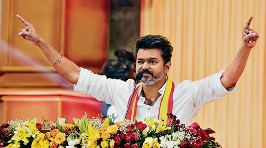 RedShiftNow's tweet photo. Higher Powers Smile Upon Vijay's Political Fortune:

After much ado, actor Vijay has announced his political entry on October 27th. 

Tamil Nadu politics is rooted in Dravidianism, sowed by Thanthai Periyar. No one can do politics in Tamil Nadu without embracing Periyar. 

And so Vijay aptly took Periyar sans his atheism. To cover the religious beliefs he picked Anna. The rest of the secular, constitution, the three religious books etc are currently popular hot selling mixture. But that huge dash of Thamizh Desiyam is the catch. He has Periyar, All-Are-Equal statements, but holds on to Bhagavat Geetha the very executioner of Varnashramam. He says Thamizh Desiyam (Tamil Ethno Nationalism) and holds on to Kamarajar and salutes an army man. So what is his idea of Tamil Nationalism? Is it based on the Tamil National politics of Periyar or Perunchithranar or Tamizharasan or Prabhakaran? Or is it used to keep the popular trend created by Seeman politics to underplay Tamil Nationalism? Or is it a token gesture to show that he has distanced himself from his national backing? 

Vijay fixes DMK as his "Political Enemy." And throws a "Political Bomb" by giving out a call for alliances with "Power Share." 

The very fabric of this "Nation" India and the soul of the Indian State is entangled with its affinity for Brahmanism and its hatred for Federal rights. Its very existence itself is based on the essence of that hatred. Tamil Nadu and Dravidian politics is all but everything against that essence. 

Historically, since the formation of India, with the independence that was declared with the blessings of the minority Brahmanism, the state and its powers, which was Congress, was always about guarding the Nation that is built by pillaging the rights and blood of the federal states. The whole structure and its defenses are created in order to maintain this Nation while its federal rights and resources are exploited by the Capitalists. 

The Dravidian politics of Tamil Nadu came from its fight against this Brahminical hegemony. From Ayothi Dasar to Periyar to Anna it grew from its fight against the Manu Dharma, caste oppression, linguistic right. Dravidian politics of Tamil Nadu, emerged from Tamil soil. The electoral face of it, the DMK, grew and became stronger from the 60s Anti Hindi agitations the Mochi Por (Protest Movement Against Hindi Imposition). 

After DMK came to power, throwing out decades of Congress rule, Actor MGR, embracing Anna, came up with the creation of AIADMK with the backing up of Brahmanical forces and Indira Gandhi. Again after MGR came actor Jayalalitha who ruled the state for a considerable period of time with the backing up of the brahmanical lobby and Rajiv Gandhi. 

Then along with other political parties that emerged in that period, came up prominent players from the Tamil Cinema industry too, who trusted their strong fan base and believed that they held the chance to come to power or were in their power to be a king maker. From Sivaji Ganesan Vijayakanth, Rajinikanth and Kamal Hassan they all believed or were encouraged by the "Higher Forces" to stand against the DMK. To break this Dravidian politics that was born out of the Tamil soil.

Question is, could there be any Higher Force that favored Vijay's polical entry too!

An important political uprising happened in Tamil Nadu 2007, during the Sri Lankan War in which lakhs of Tamil people were killed. And it's a well known fact (atleast in Tamil Nadu political space) that it was the Congress Government which as a provincial power helped Sri Lankan Government to wage the war. The Sri Lankan diplomats and politicians were thankful enough to call Indian state a 'spade'. During the 2009 parliamentary elections of 2009, various Students movements all over Tamil Nadu got together and campaigned against Congress condemning its involvement in a war that killed fellow Tamils. Since then, Tamil Nationalism resurged powerfully into the Tamil political space demanding Self Determination of Tamils, Dissolution of Centre's powers etc. 

After Dravidianism, it was Tamil Nationalism that clearly demarcated the Brahmanism that built the country of India and its oppression over the people of various states economically, socially and culturally. Thus Tamil Nationalism stood steadfast against National parties politics in Tamil Nadu. BJP used Seeman or Seeman helped BJP to undermine Tamil Nationalism with rhetoric-cinematic-stories. And Congress, which was originally hunted down by the upsurge of Tamil Nationalism for its part in Sri Lankan war, was yet to make a move to curtail the surge. 

Sri Lankan war ended in 2009. Vijay was called by Rahul Gandhi in the same year for a meeting. And the same year saw parliamentary election. The same year when Tamil students were campaignig against Congress. Vijay, with his political ambitions, proposed to join Congress, Rahul Gandhi supposedly said Vijay to start his own party during the meeting.

Vijay's graph of showing up in national politics didn't end. He later met Anna Hazare. In 2014, Modi too. For more than a decade he kept weighing in all his options. 

The two national parties of India Congress and BJP are of two right ideological-capitalists controlled power structures. One of a light Hindutva another of Extreme Hindutva. While congress may be all 'WOW' for 'Federalism' now, the underlying fact is it is always about 'National' Politics. 'CENTRAL' Power. And congress with all its shimmer faded, now with the whitewashed Rahul Gandhi, has been trying to make a comeback holding on to regional parties in states. And they have been doing a better job at it too. 

While all 'Secular' political parties and movements in the country have declared extremist BJP as their enemy, like TVK's Vijay declaration of them as Ideological Enemy, the juggling and move of powers is now within the secular parties. While congress may showcase and ally with the regional political parties it is always starving to get back to its old sheer of "mass political power." And the only way to do it is by diminishing the regional parties. 

So who's puppet Vijay possibly be?
