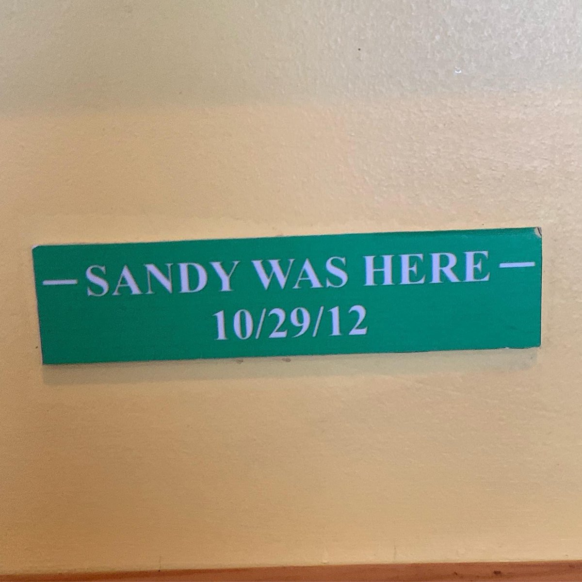 CathySchutte's tweet photo. On this day, Hurricane Sandy which became Superstorm Sandy impacted the northeast with huge storm surge, strong winds and flooding rain. This sign in the Tres Palms restaurant is a reminder that we will never forget it’s impacts. 🌀 #SuperstormSandy #weather #OTD https://t.co/cOATO5DvB2