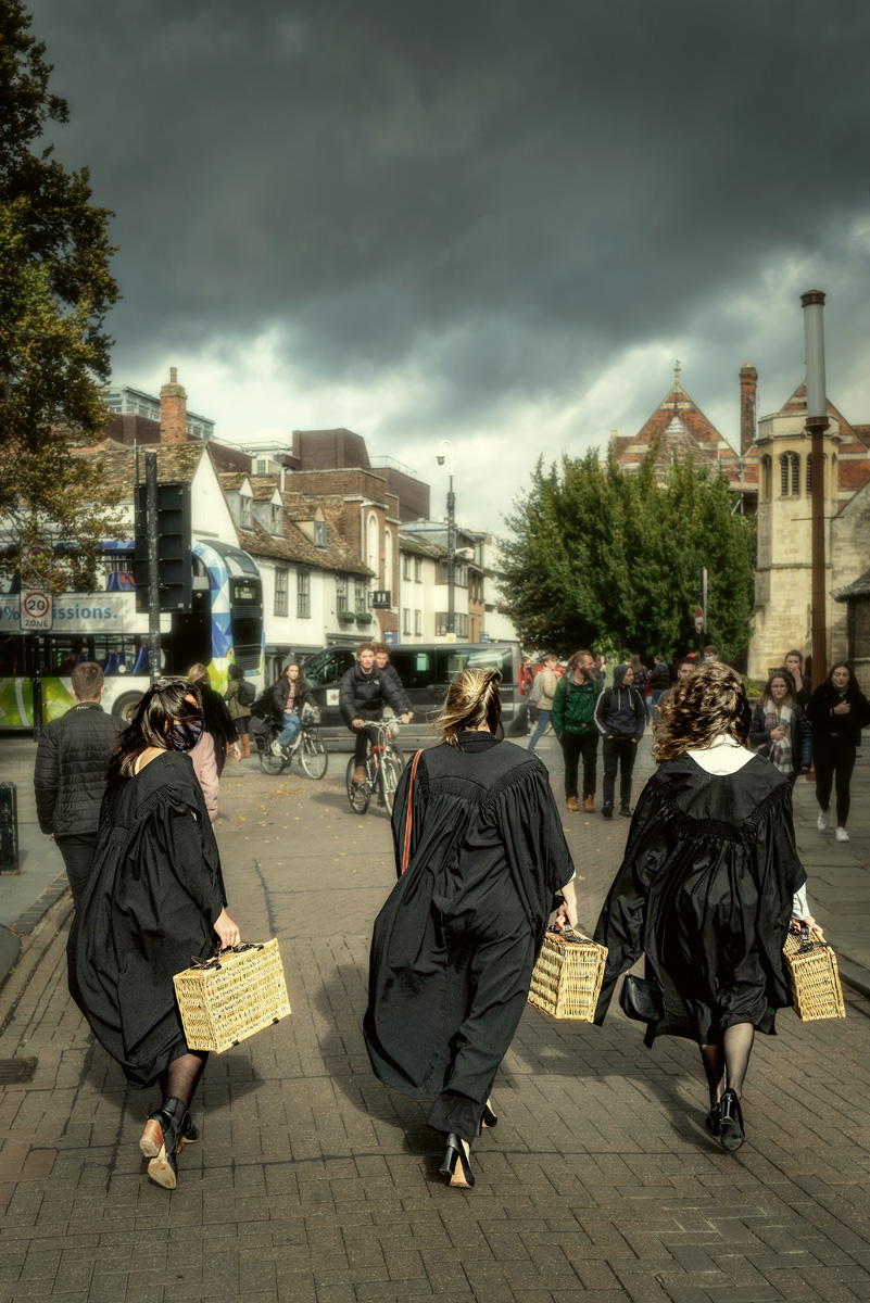 'In 2018, a new student at Downing College hurries past the library to take his place for the official matriculation photograph; whilst in 2020, due to social distancing, students receive picnic hampers in place of the traditional matriculation dinner'
From my new book 'Cambridge