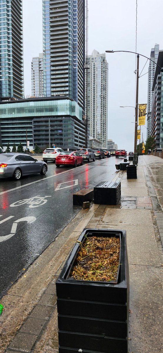 YYZdesign's tweet photo. @311Toronto Could please you let the roads dept know that someone knocked a number of these planters over into the bus lane? West side of Spadina, south of Front. Maybe check the east side to. TYIA https://t.co/VjzwbZJN20