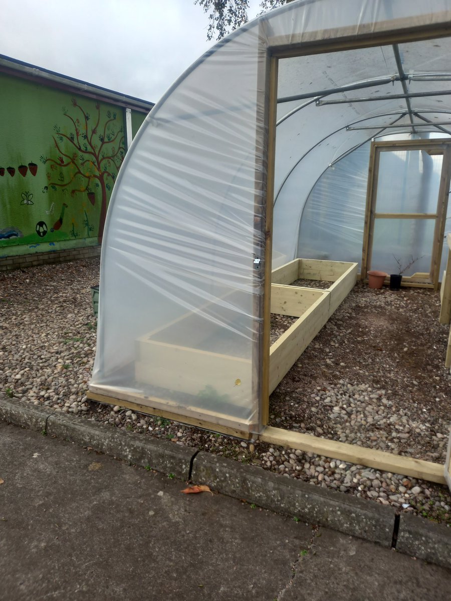 NewRowPS's tweet photo. When a NRStP family deliver the goods over half term! Barry Diamond, dad to Fionn and Oisin, worked so hard to kit out our new polytunnel.  Think the boys &amp; Granda Liam lent a hand, too! Massive thanks - Mrs Stuart has sooooo many plans already! #NRStPfamily 💙💚 @Eco_SchoolsNI https://t.co/OhmYZkXLXe