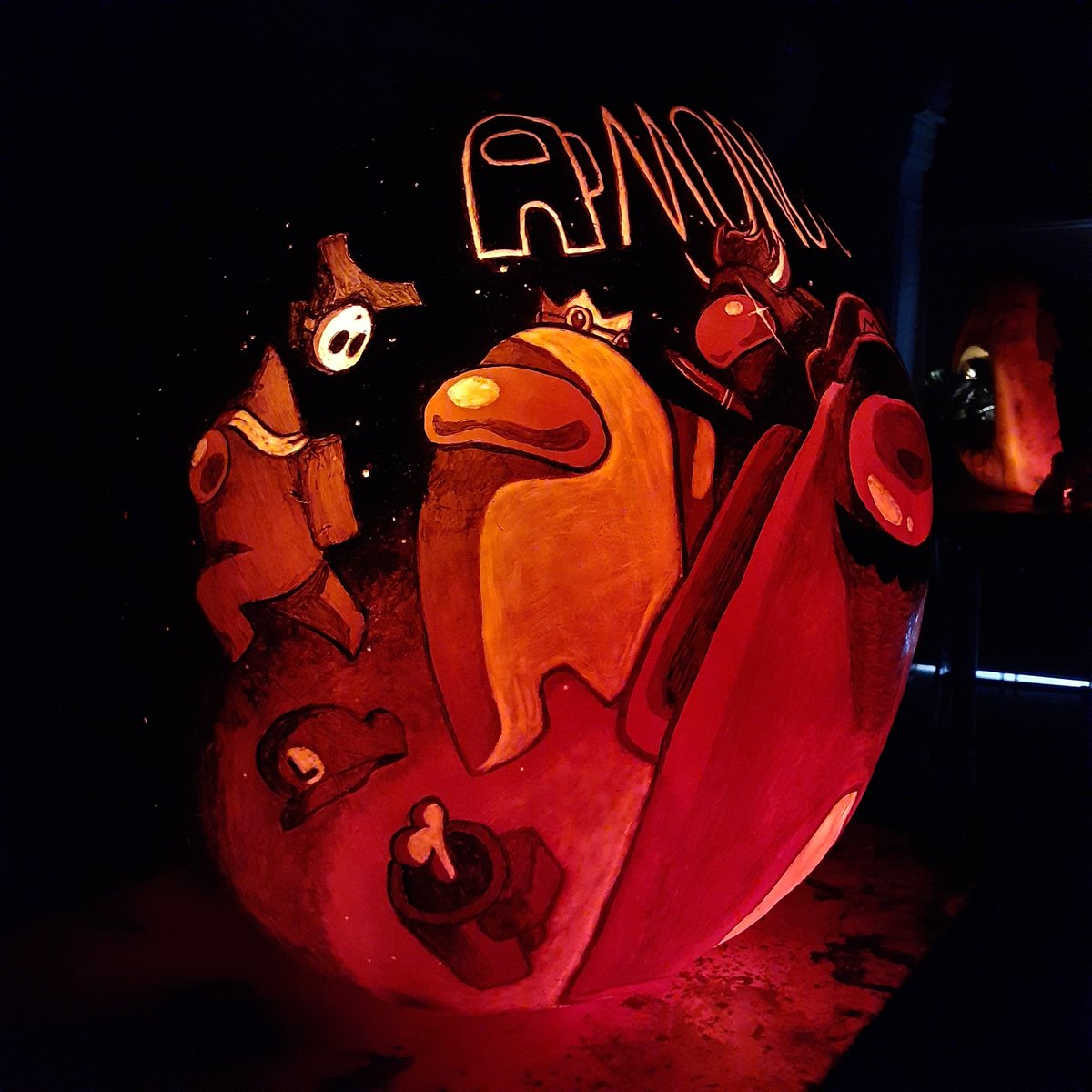 AngelaBrockArt's tweet photo. Something about this pumpkin seems kinda sus... 🤔

I had quite a bit of fun with this Among Us pumpkin~ 🎃 All of the little crewmates (and imposter 🤫) are dressed up as Mario characters for Halloween!

#amongus #pumpkinart #pumpkincarving #jackolantern https://t.co/mGi3HsGbxo