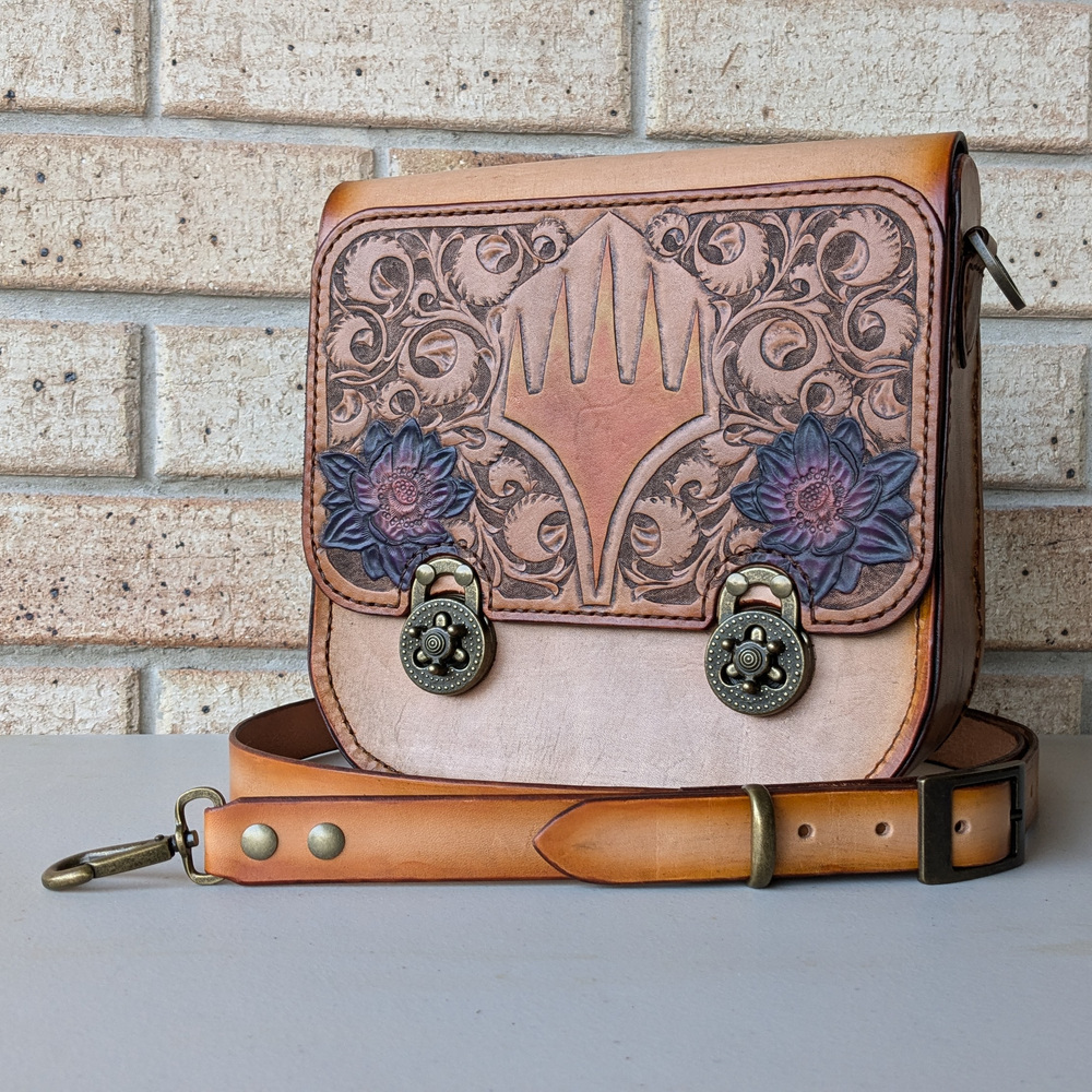 DesertBus's tweet photo. 🚨Our first prize previews are a quartet of intricately crafted items that will be available during exhilarating Live Auctions. They include a Beauty and the Beast Window Clock, Magic the Gathering Leather Bag, Needle Felted Calcifer and Miniatures, and
Tamiyo &amp; Nashi Portrait. https://t.co/i3GsvG8A5n