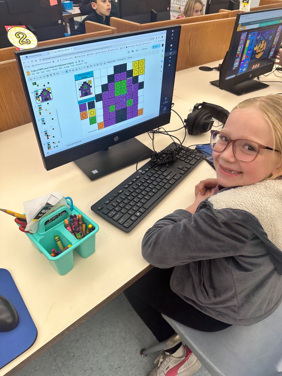 HoldenTheTech's tweet photo. 🎃 👻 Today our students got techy with Halloween-themed pixel art! 🖥️ 🌟 Using drag and drop and copy and paste skills, they created spooktacular designs! Check out our festive creations! #pixelart #halloweenfun #techskills https://t.co/C0vzoJVF16