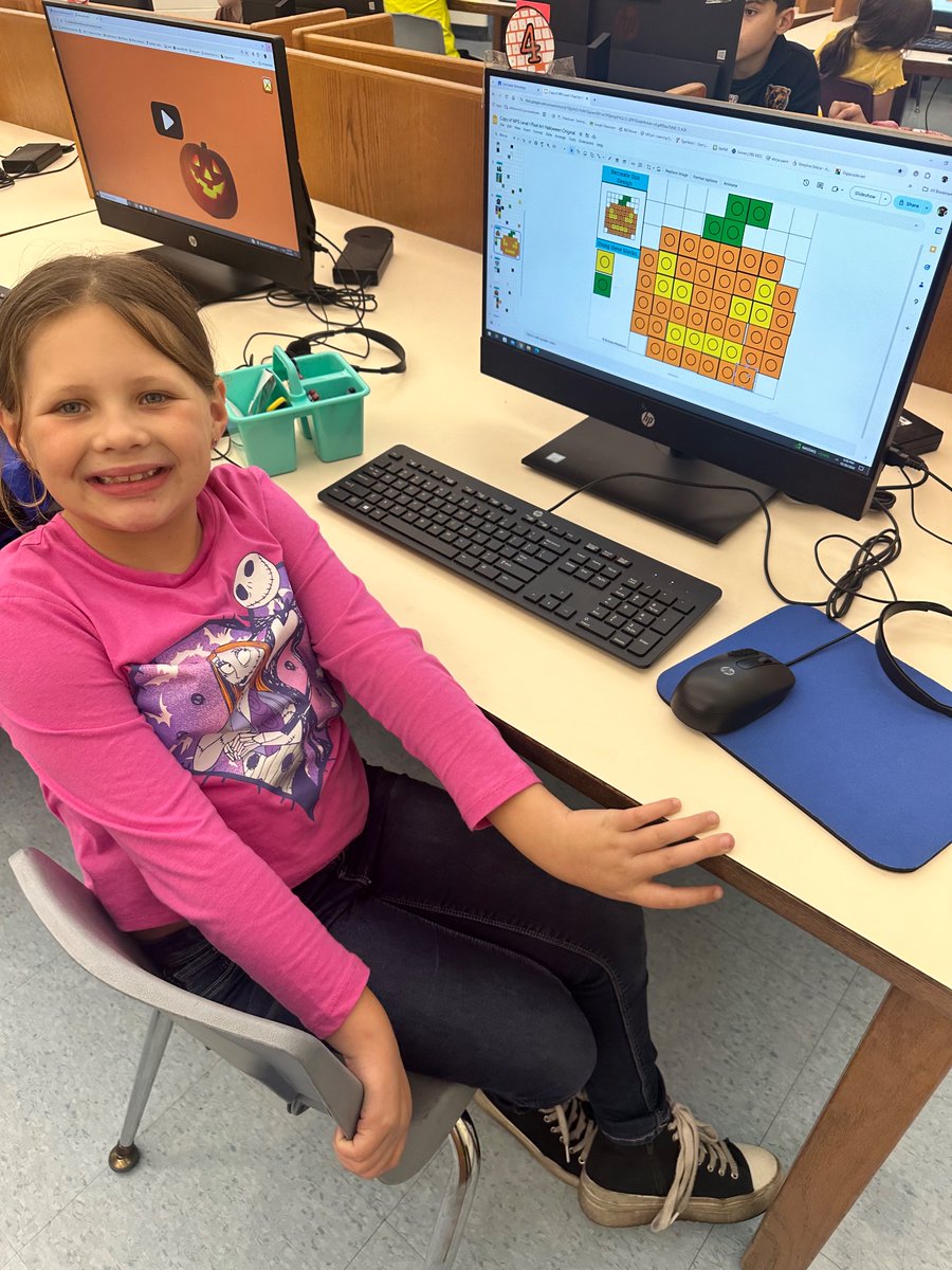 HoldenTheTech's tweet photo. 🎃 👻 Today our students got techy with Halloween-themed pixel art! 🖥️ 🌟 Using drag and drop and copy and paste skills, they created spooktacular designs! Check out our festive creations! #pixelart #halloweenfun #techskills https://t.co/KGpWssKbFn