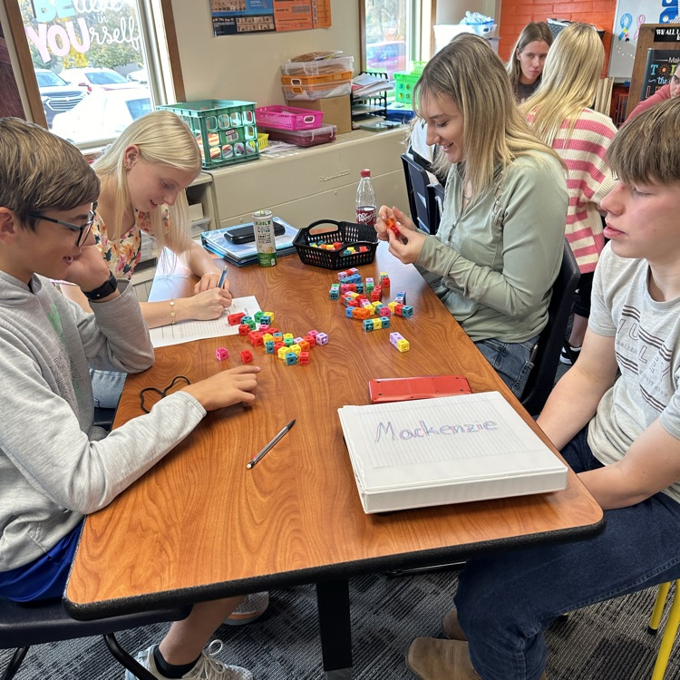 ThayerCentral's tweet photo. Speedy Squares activity in College Algebra to collect data for quadratic regression. Students had to time each other making squares of different sizes using interlocking cubes and graph the results. Then they made a model to predict time to make a 26x26 square. https://t.co/dhX1acldDo