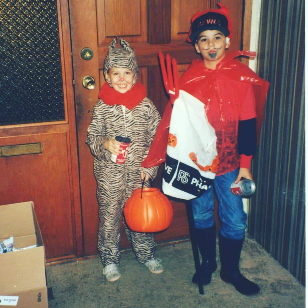 cameronboyes's tweet photo. A vintage Halloween picture of my sister and myself, where I assumed my true form as the prince of lies (complete with a New Jersey Devils hat to complete the ensemble) https://t.co/k3vLoCJWr4