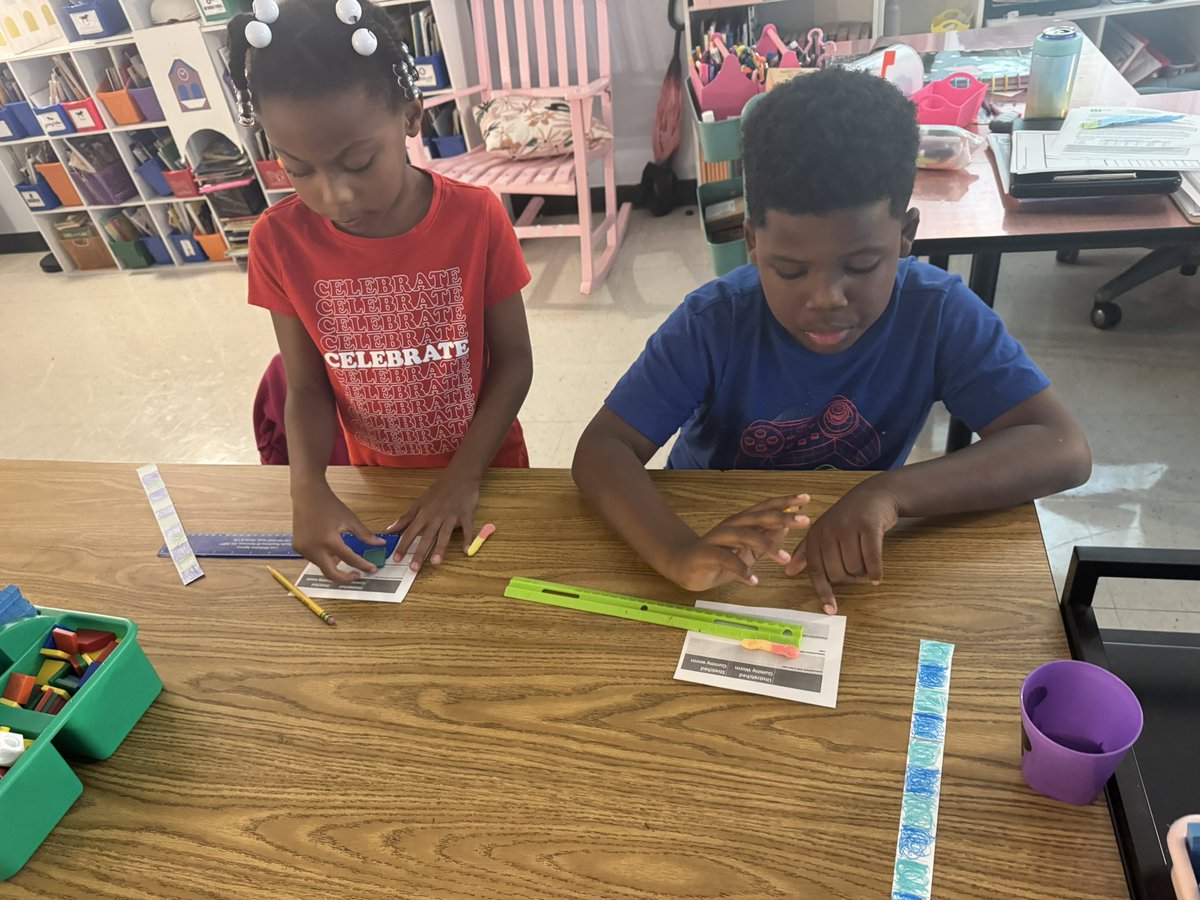 Practicing measurement with inch tiles, handmade rulers, and regular rulers. Students made the connection that their measurement with any tool should be the same because they are all in inch increments. <a href="/DunwoodySprings/">DunwoodySpringsElem</a>