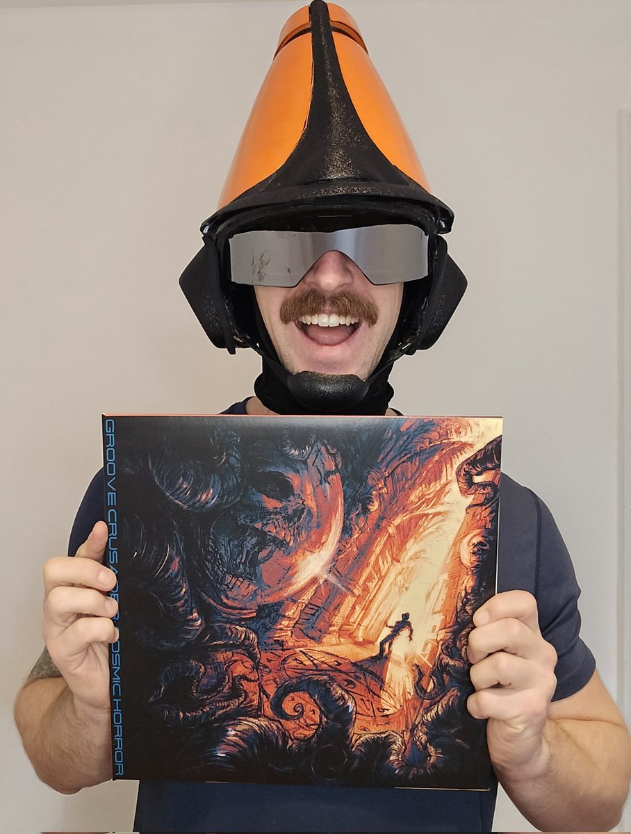 IT'S HERE.

Celebrating a year since the Cosmic Horror release, I present to you a dual EP vinyl split!

Plus bonus unreleased artwork!

Bundle it with a CD ft. the Cosmic Horror short story finally in print!

Exclusively on Bandcamp:
Groovecrusader.bandcamp.com