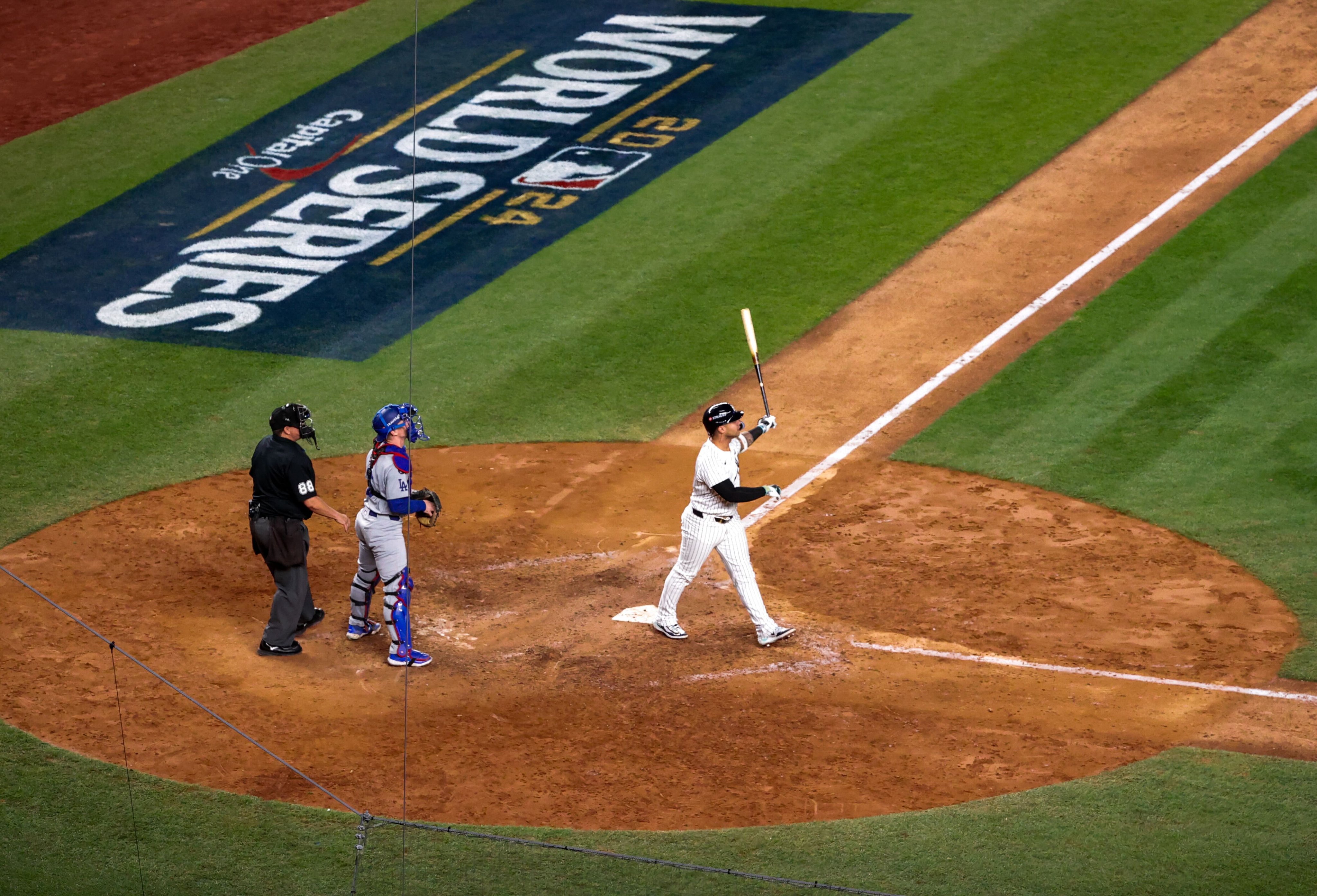 Gleyber Torres watches his 3-run homer. 
