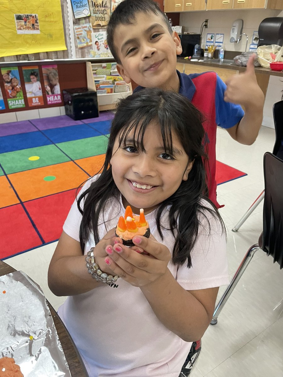 KatyHafner's tweet photo. Homework huddle was a success again tonight. Who doesn’t love cookies, chocolate and getting a little messy? We do! I just love seeing these smiles…on the kids faces too! 🎃 #coolclub #cookiesforthewin #JackOLanterns #DreamItDoIt https://t.co/7NwxYdUXON