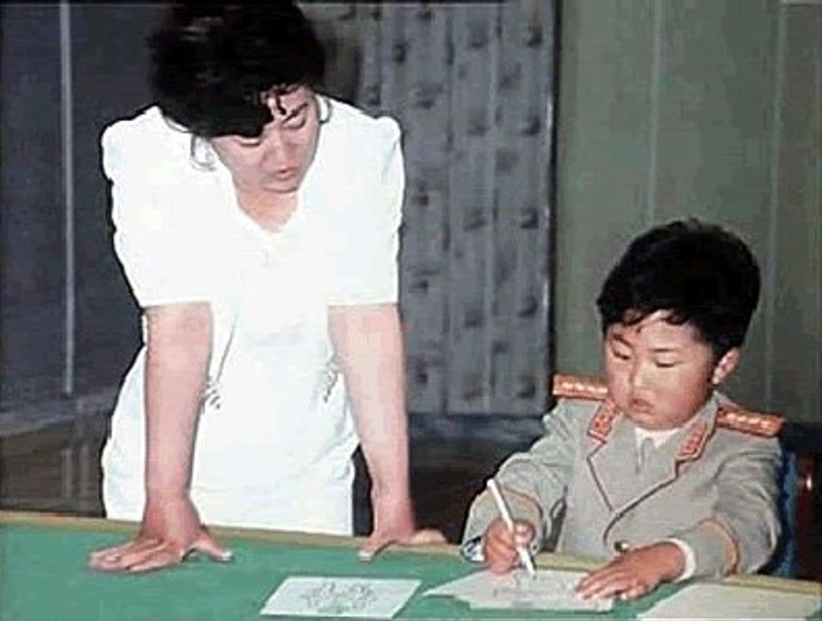 North Korea's current leader Kim Jong-un with his first teacher, 1990