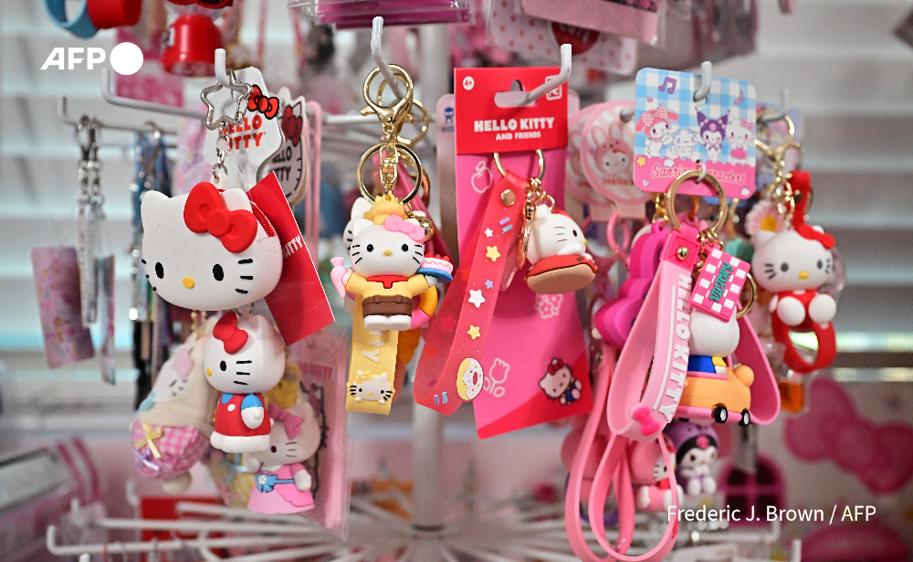 AFP's tweet photo. 'CEO of supercute': Hello Kitty turns 50. 

The simple design of the character -- who is not a cat, but a little girl from London according to Sanrio, adorns everything from bags to rice cookers and still makes millions for her Japanese creators

https://t.co/1Ckls1B4NA https://t.co/cAwNXzxCy4