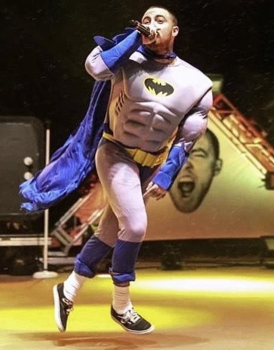 Mac Miller wearing a Batman costume during his Halloween Red Rocks performance (2015).