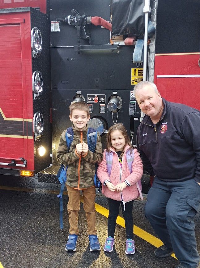 Congratulations to these two students who had a unique ride to school this morning.  And thank you to the Danville Fire Department for making a ride to school in a fire truck one of the raffle prizes at the Fall Festival!