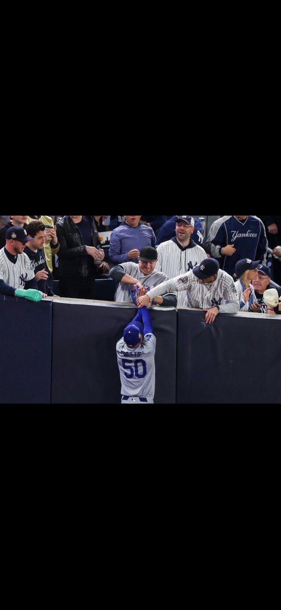 kobesgame's tweet photo. A lot of absurdity in this picture, but the guy wearing a sliding mitt in the stands ranks as the most absurd. https://t.co/kGMTXEnDvQ
