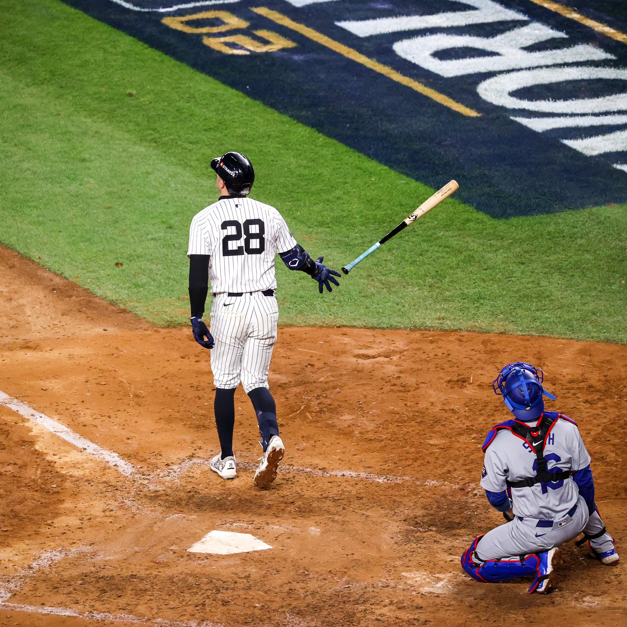 Austin Wells drops his bat after hitting a home run.