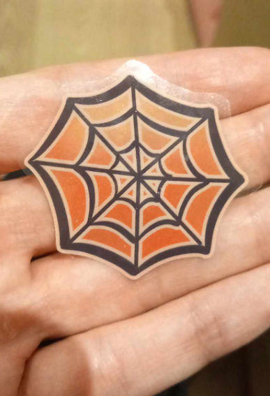 2yo peels off this Halloween sticker, brings it to me, and says "crafting table!".
The training is going well.