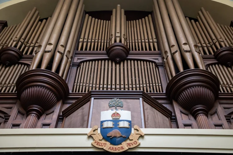 UofT's tweet photo. The man behind the music: #UofT’s official organist John Tuttle retires after 45 years #UofTGrad24 🎹 https://t.co/yjaFmNQFq4 https://t.co/nyxj0kFHjb