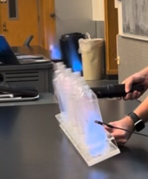 Jon_RK1's tweet photo. A little methanol in plastic bottles sealed with corks.  A spark ignites an impressive reaction that really wakes up an early morning @PurdueChemistry Gen Chem class! https://t.co/9oFSZdwoOn