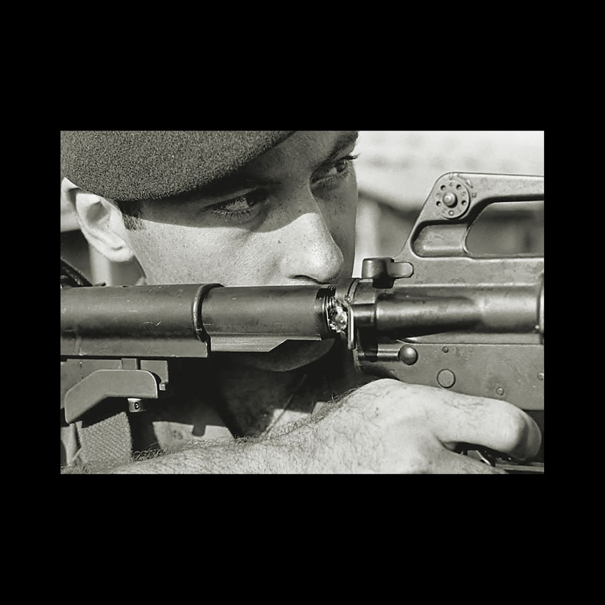 Divine intervention - SF soldier Bill Deacy holds the rifle that saved his life in more ways than one. An enemy bullet would strike his rifle and save his life.