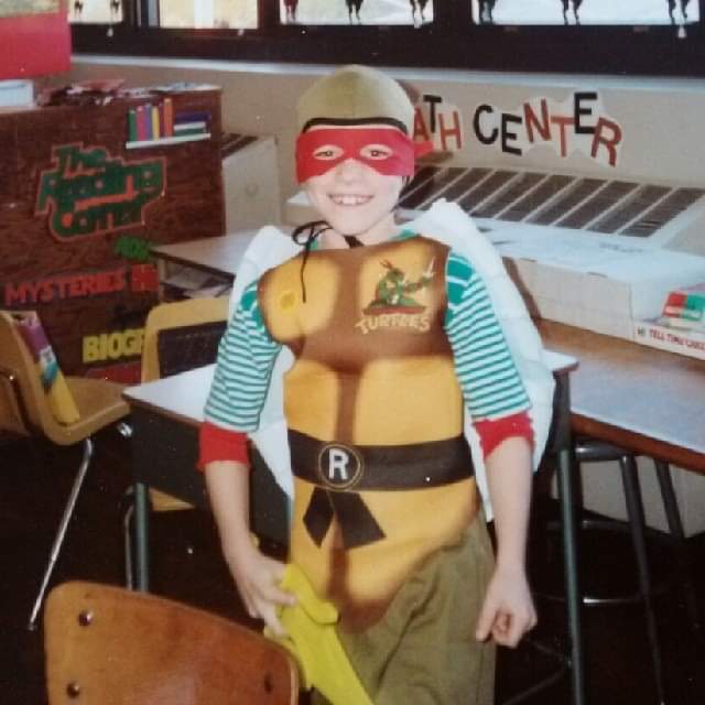 Costume reveal! This year I'm dressed as 4th Grade me dressed as Raphael! 🐢

And yes - this is an actual, adult-sized 1988 Turtles costume! The same style I wore as a kid! And a He-Man sword for a sai!