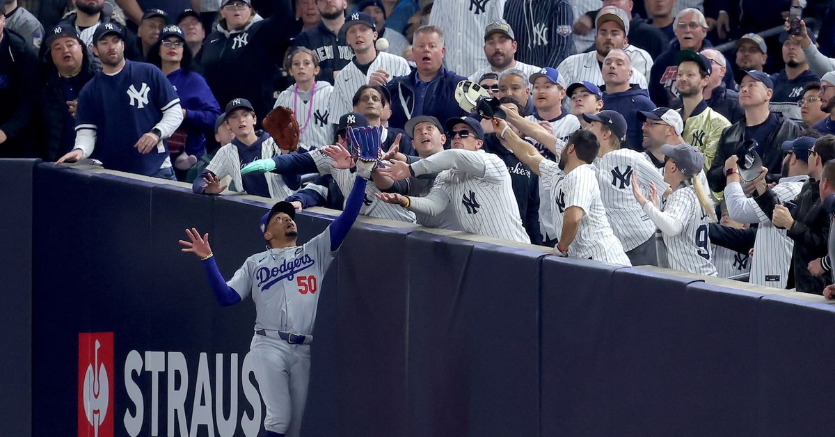 Reuters's tweet photo. You're out! Yankees fans who grabbed Betts banned from Game 5 of World Series https://t.co/jLTg5b4Xvb https://t.co/abaYKuVScd