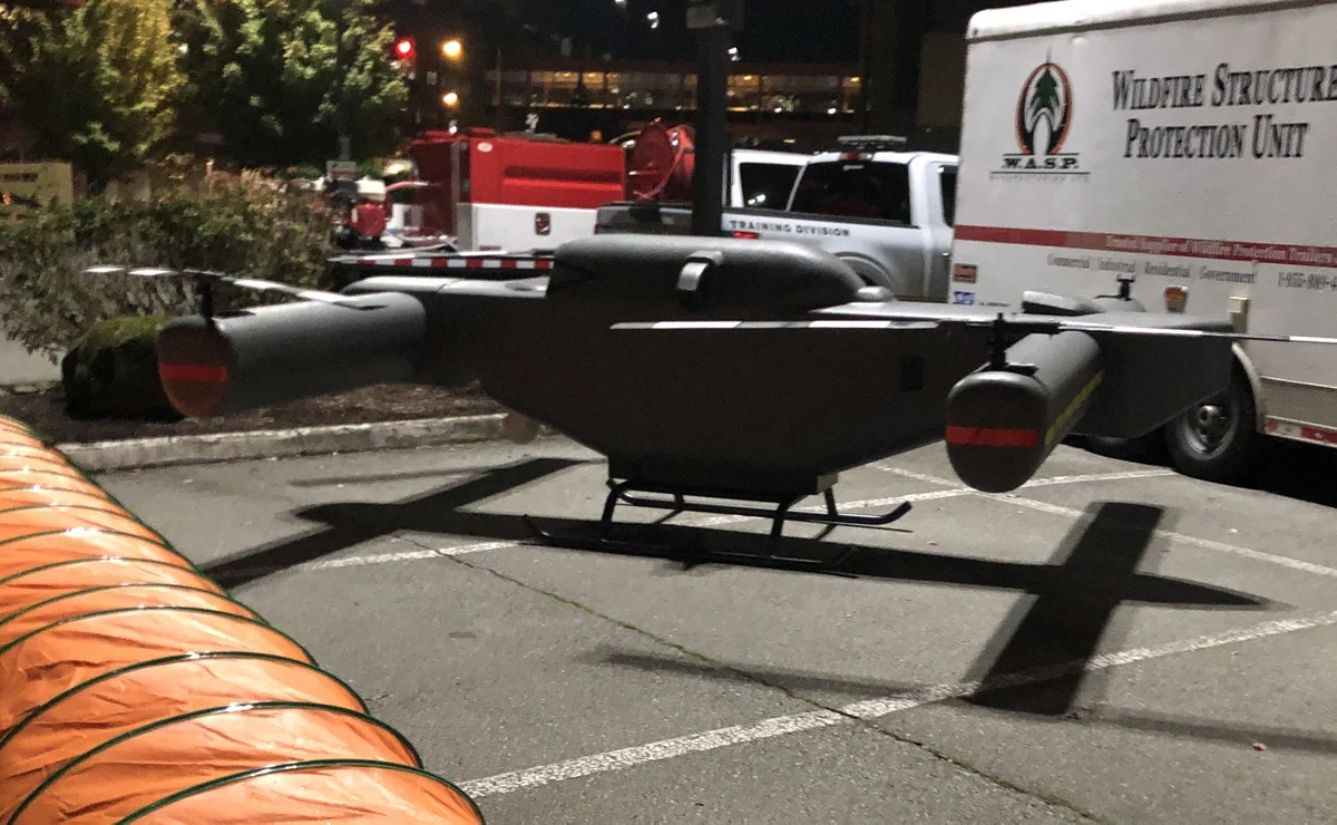 FireSwarm Wildfire fighting UAS drone at conference. Heavy lift, long endurance.