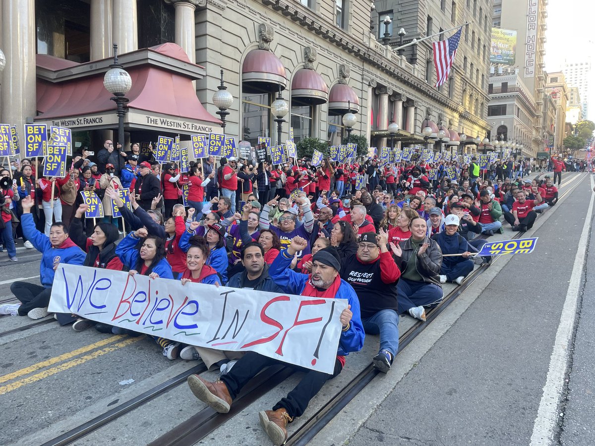 BREAKING: Dozens of striking workers have occupied the Powell St cable car tracks in a demonstration of civil disobedience. Workers say they are prepared to be arrested. SFPD is here but not arresting anyone yet