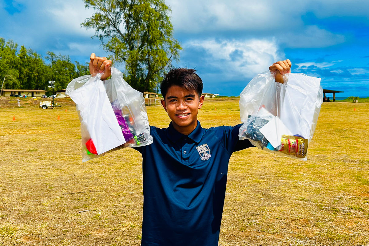 IPA Gives Back! Our Navigators recently brought calligraphy lessons to seniors at 'Ilima at Leihano, volunteered at the Okinawan Festival, and honored WWII heroes of the 100th and 442nd with flags and flowers. They also assisted service members at the Air Force Mahalo Bash.