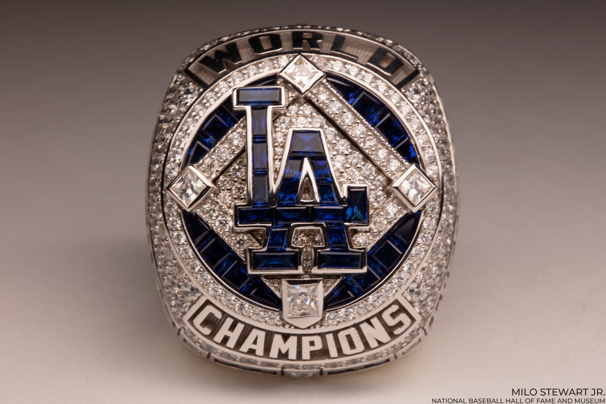 Los Angeles Dodgers 2020 World Series ring with an LA logo made up of dark blue gemstones surrounded by clear gemstones arranged in a diamond shape. (Milo Stewart Jr./National Baseball Hall of Fame and Museum)