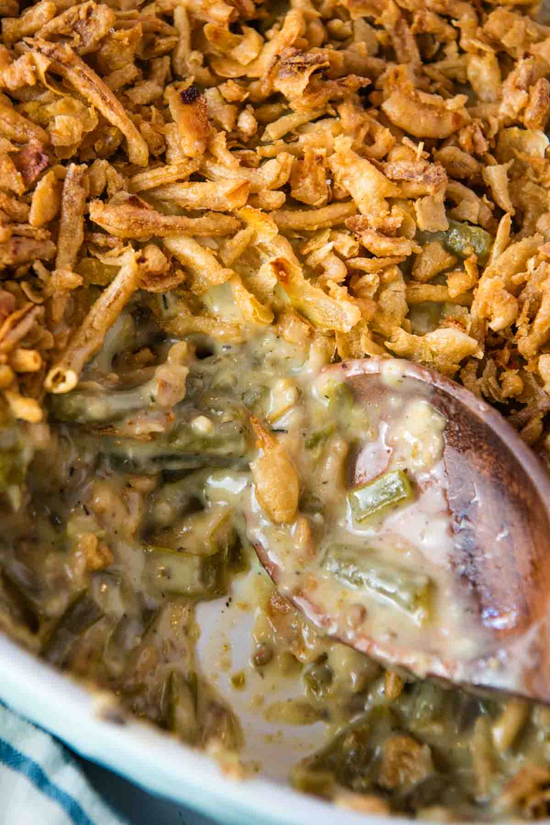 How to make the best homemade green bean casserole from scratch with canned green beans, creamy mushrooms, and French fried onions. Add this essential Thanksgiving side dish to your menu of #Thanksgiving recipes. adventuresofmel.com/green-bean-cas…